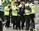 Police, fire and ambulance crews participate in a drill in the event of a terrorist attack during the Olympic games, at a disused underground station in London