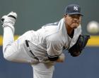 epa03260411 New York Yankees starting pitcher Ivan Nova delivers to an Atlanta Braves batter in the first inning of their interleague MLB baseball game in Atlanta, Georgia USA, 11 June 2012.  EPA/ERIK S. LESSER
